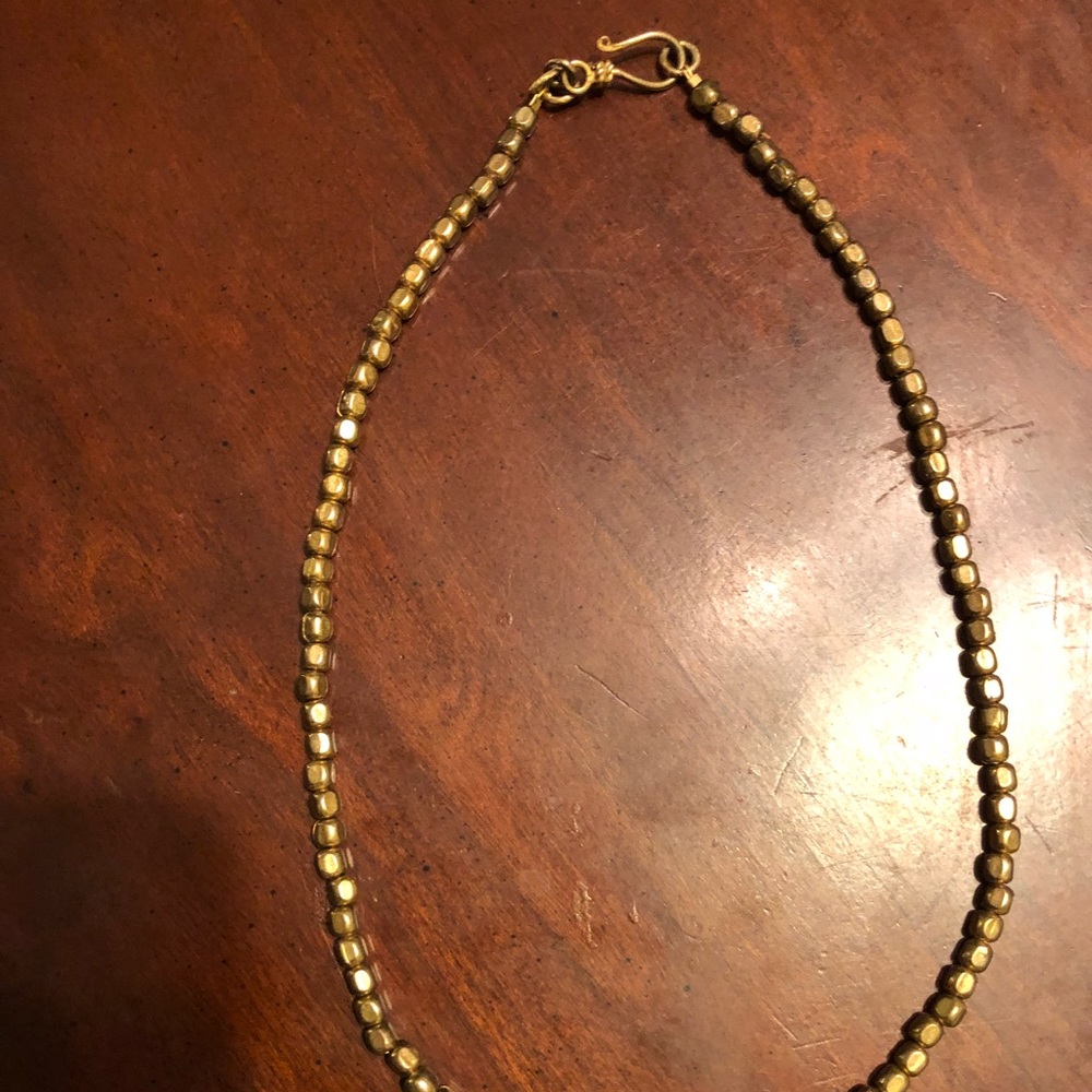 Gold colored necklace